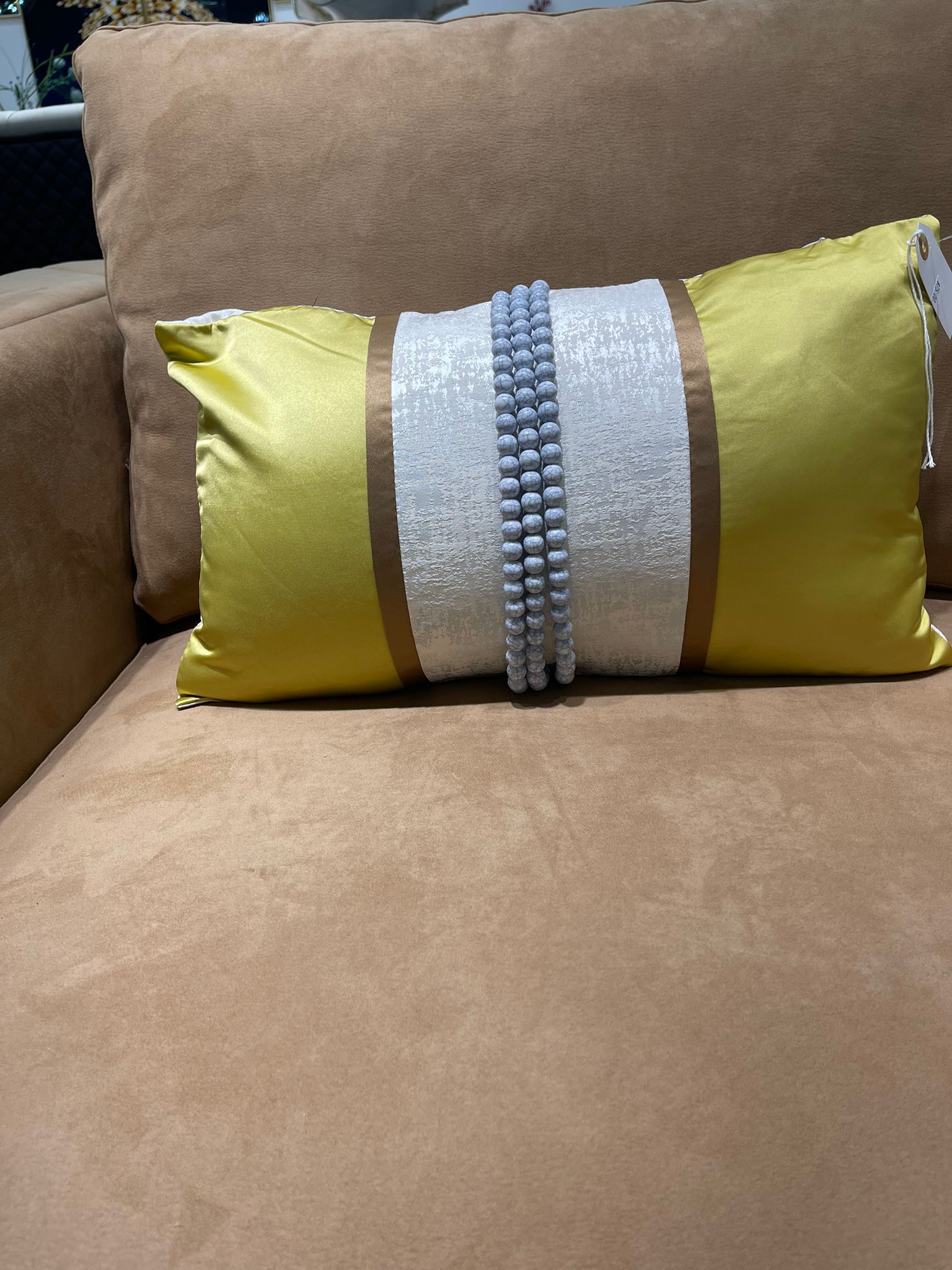 Add a touch of elegance and texture to your home with the Yellow and White Beaded Throw Pillow. This beautifully handcrafted pillow features intricate beaded detailing that brings a subtle shimmer and luxurious feel to any space. The vibrant yellow and crisp white design makes it a perfect accent for sofas, chairs, or beds, adding a pop of color and charm to your living room or bedroom.