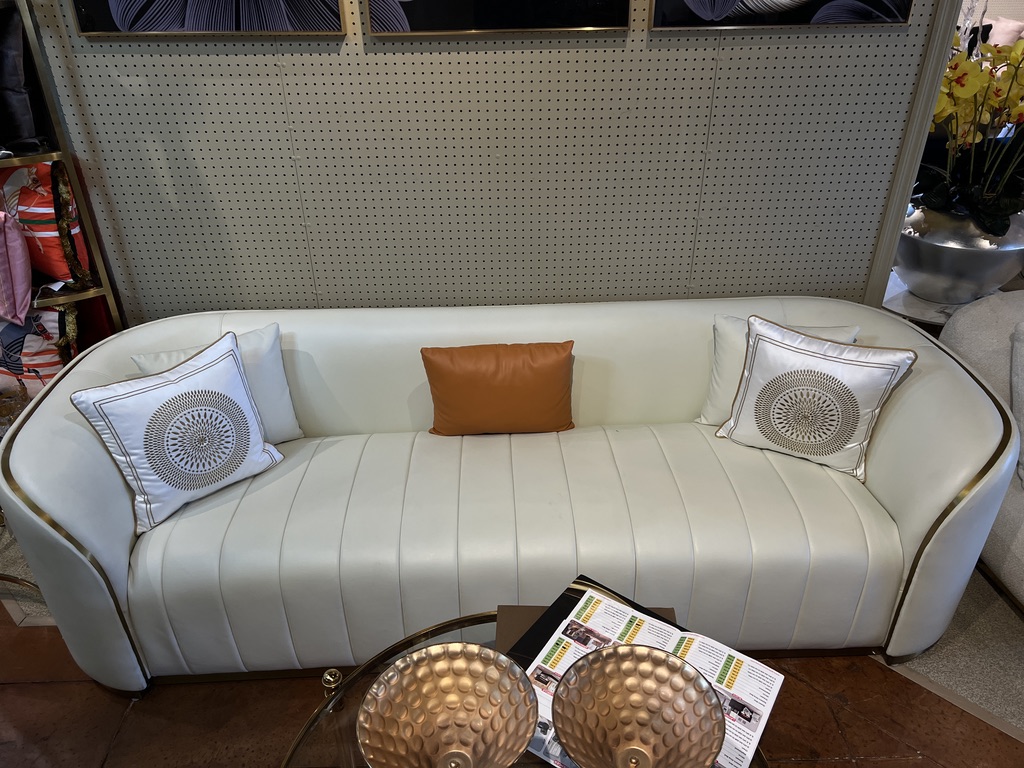 Ivory Curved Sofa — showroom photograph
