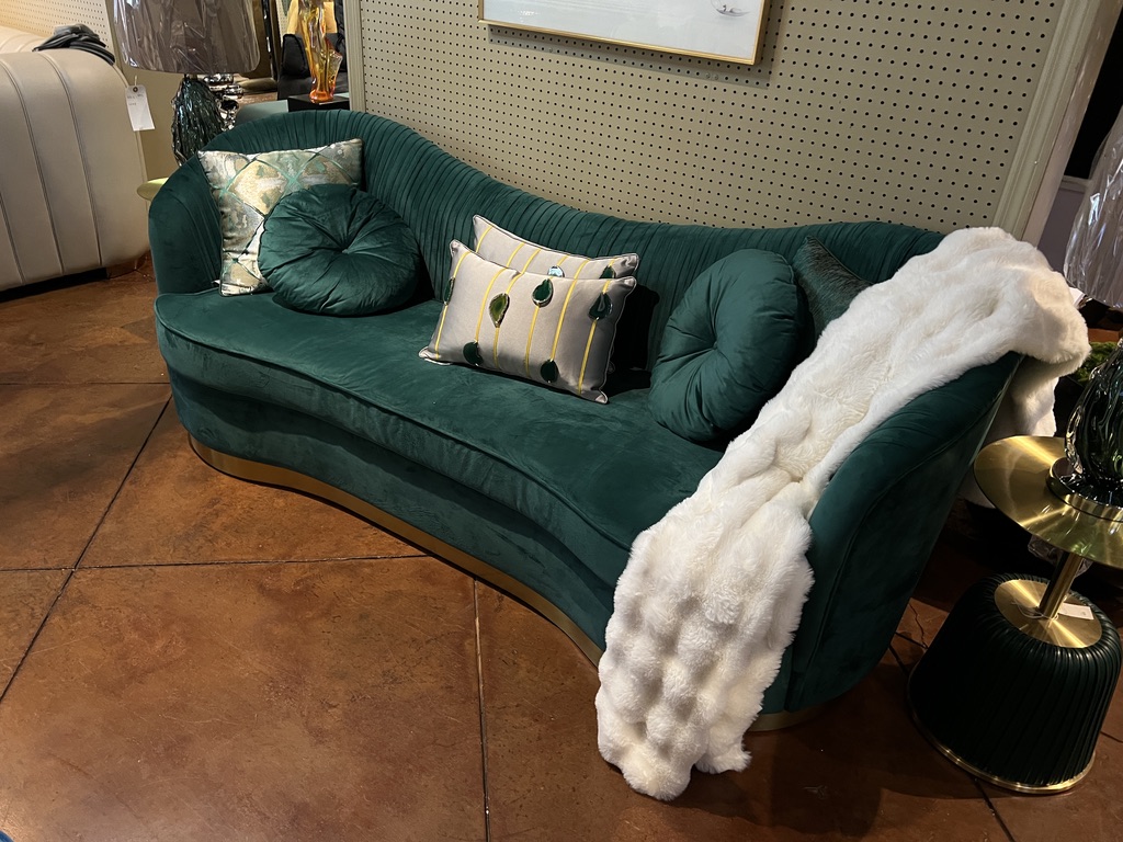 Curved Pleated-Back Sofa — showroom photograph