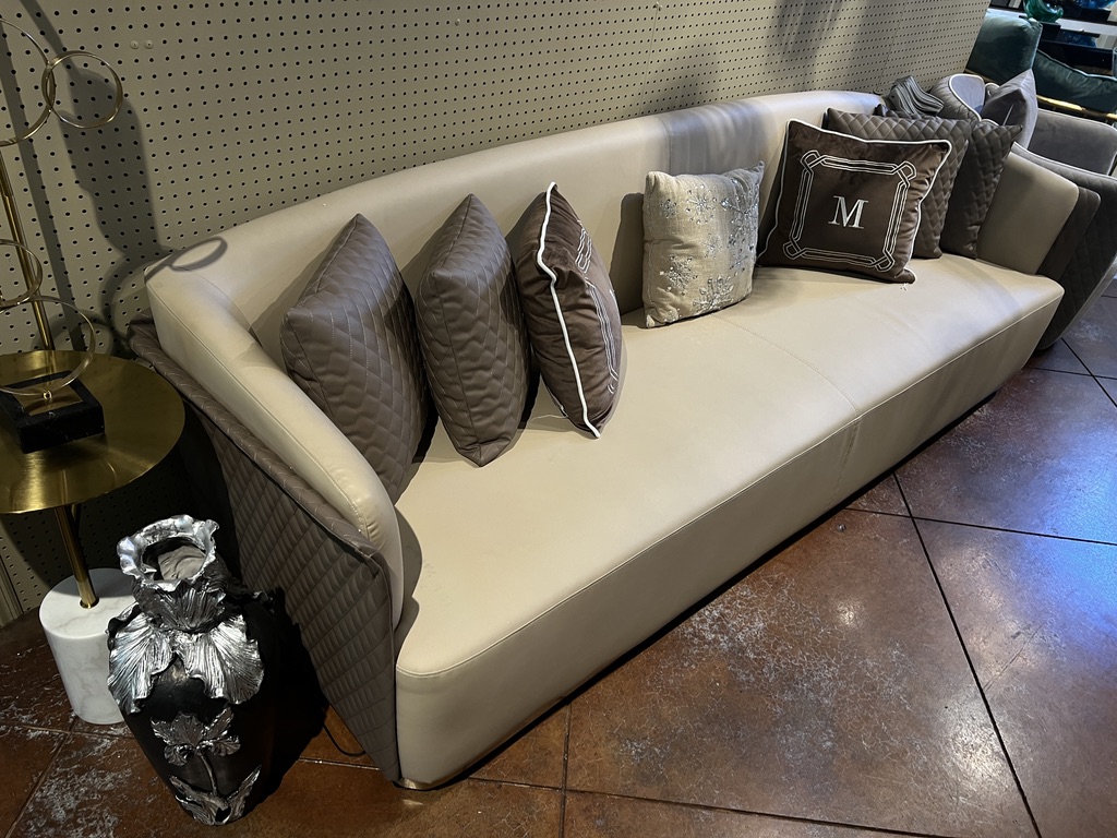 Cream Sofa with Quilted Outer Panels — showroom photograph