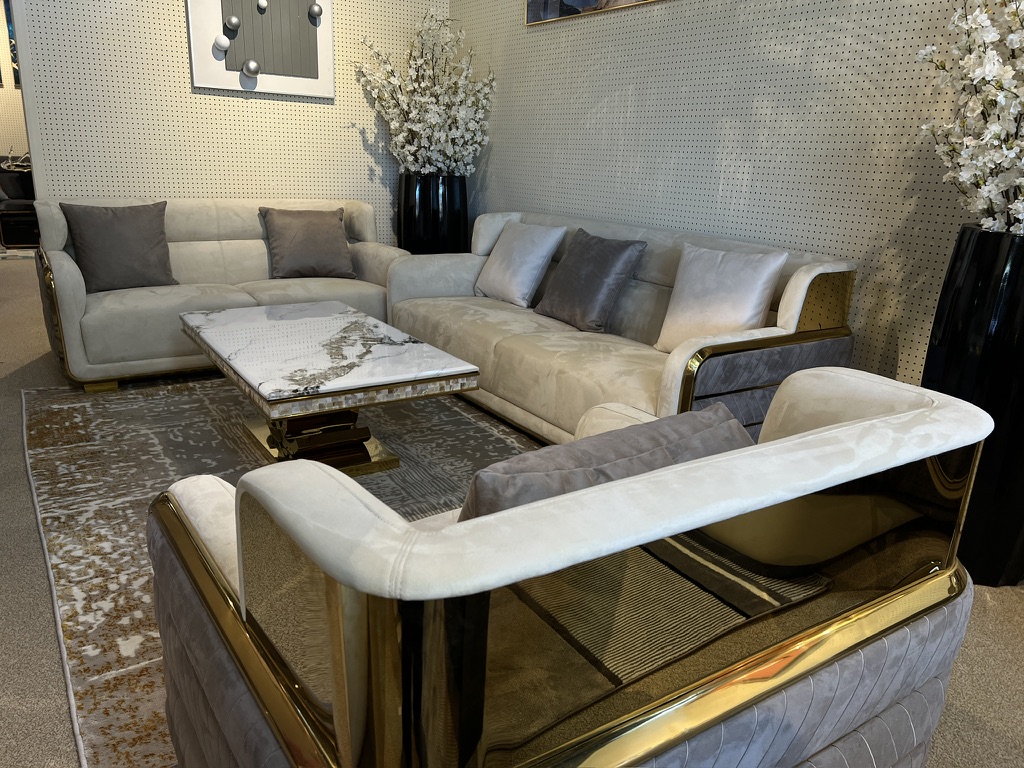Cream and Gray Sofa with Gold-Tone Frame — showroom photograph
